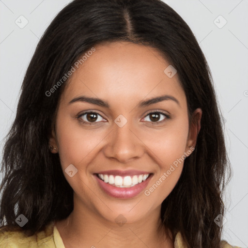 Joyful latino young-adult female with long  brown hair and brown eyes