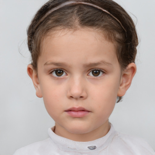 Neutral white child female with short  brown hair and brown eyes