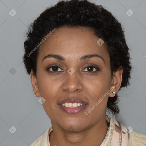 Joyful black young-adult female with short  brown hair and brown eyes