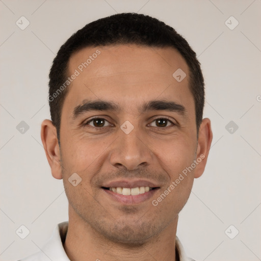 Joyful white young-adult male with short  black hair and brown eyes