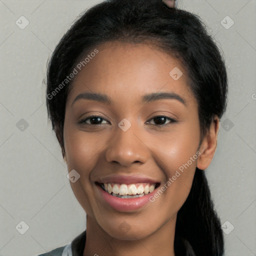 Joyful latino young-adult female with long  black hair and brown eyes