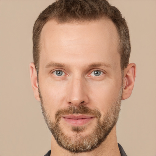 Joyful white adult male with short  brown hair and grey eyes