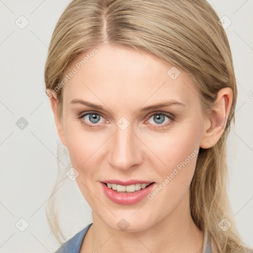 Joyful white young-adult female with medium  brown hair and blue eyes