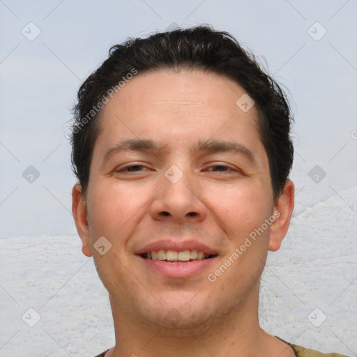 Joyful white young-adult male with short  brown hair and brown eyes