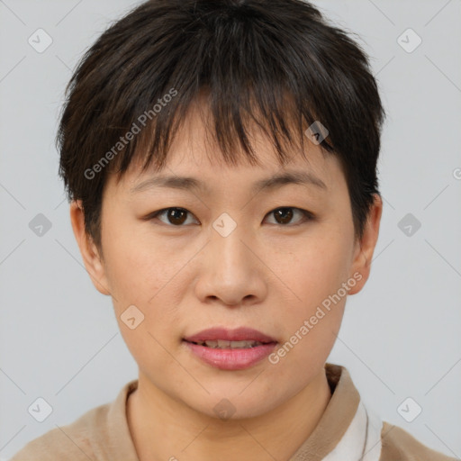 Joyful asian young-adult female with short  brown hair and brown eyes