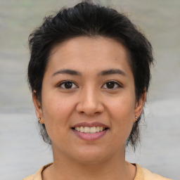 Joyful asian young-adult female with short  brown hair and brown eyes