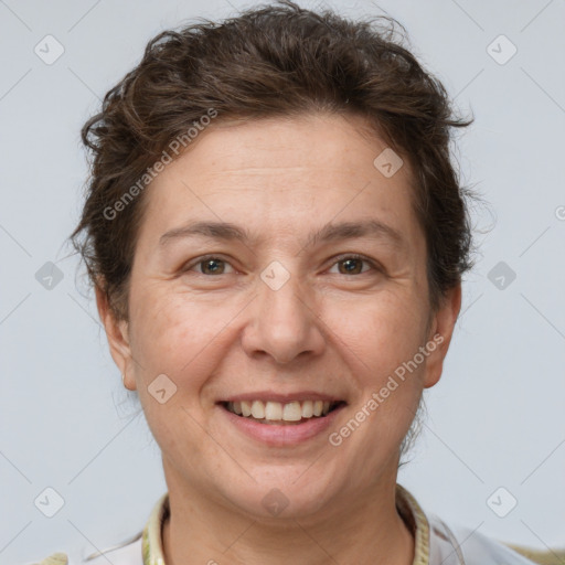 Joyful white adult female with short  brown hair and brown eyes