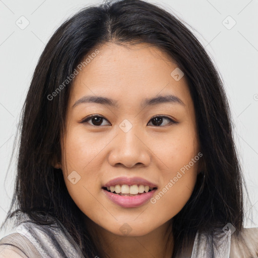 Joyful asian young-adult female with long  brown hair and brown eyes