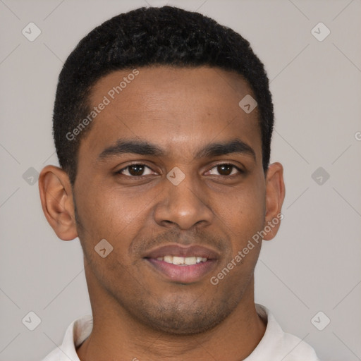 Joyful black young-adult male with short  brown hair and brown eyes