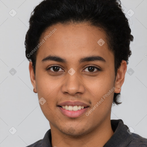 Joyful latino young-adult male with short  black hair and brown eyes