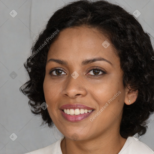 Joyful black young-adult female with medium  brown hair and brown eyes