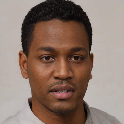 Neutral black young-adult male with short  black hair and brown eyes