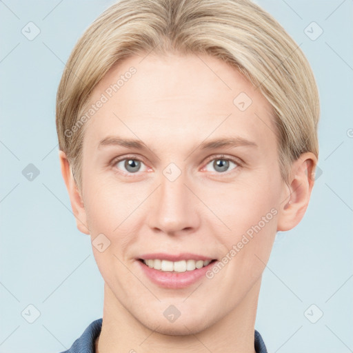 Joyful white young-adult female with short  brown hair and blue eyes