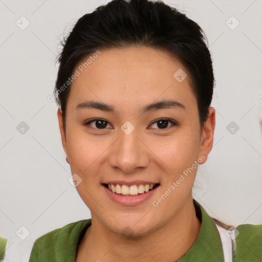 Joyful asian young-adult female with short  brown hair and brown eyes