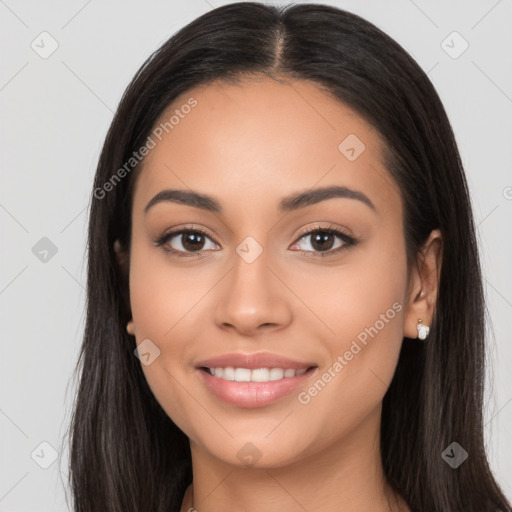 Joyful latino young-adult female with long  brown hair and brown eyes