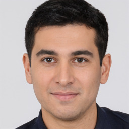 Neutral white young-adult male with short  black hair and brown eyes