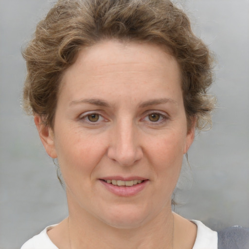 Joyful white adult female with short  brown hair and grey eyes