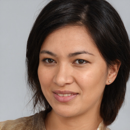 Joyful white young-adult female with medium  brown hair and brown eyes