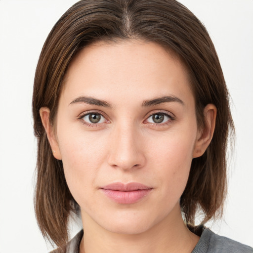 Neutral white young-adult female with medium  brown hair and grey eyes