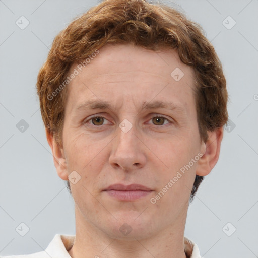 Joyful white adult male with short  brown hair and grey eyes