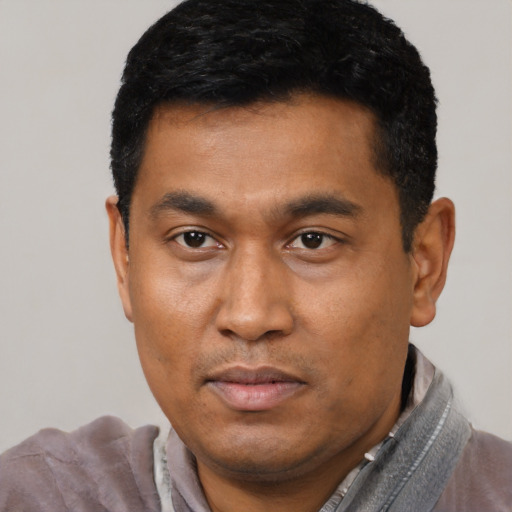 Neutral black young-adult male with short  black hair and brown eyes