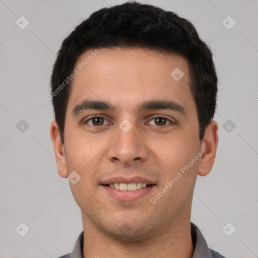 Joyful white young-adult male with short  black hair and brown eyes