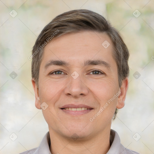 Joyful white young-adult male with short  brown hair and brown eyes