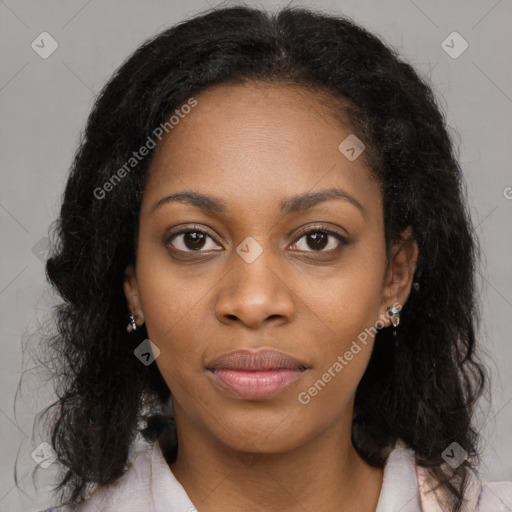 Joyful black young-adult female with long  black hair and brown eyes