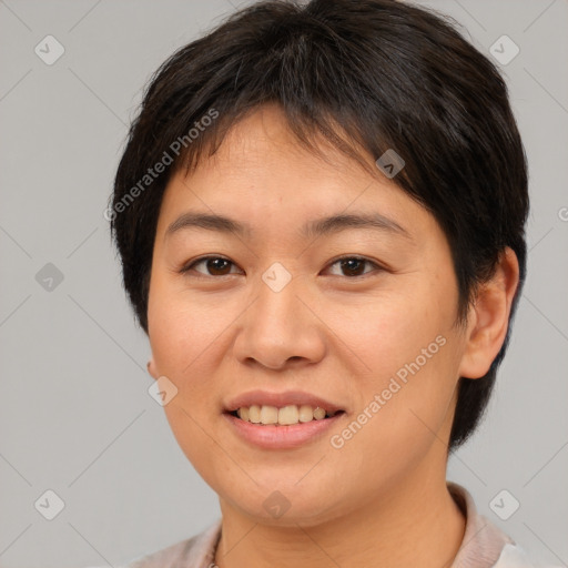 Joyful asian young-adult female with short  brown hair and brown eyes