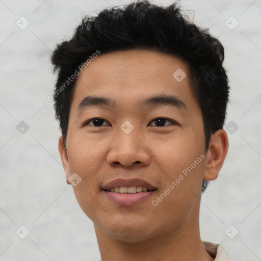 Joyful asian young-adult male with short  black hair and brown eyes