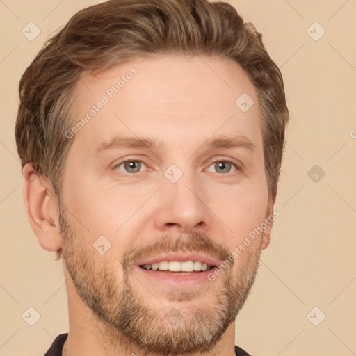 Joyful white adult male with short  brown hair and brown eyes