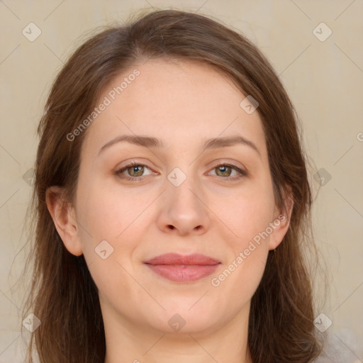 Joyful white young-adult female with long  brown hair and green eyes