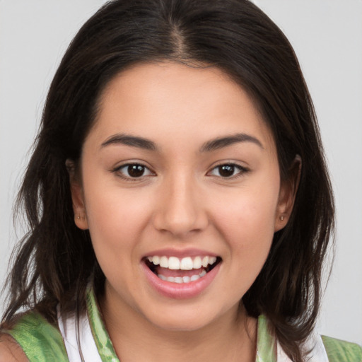 Joyful white young-adult female with medium  brown hair and brown eyes