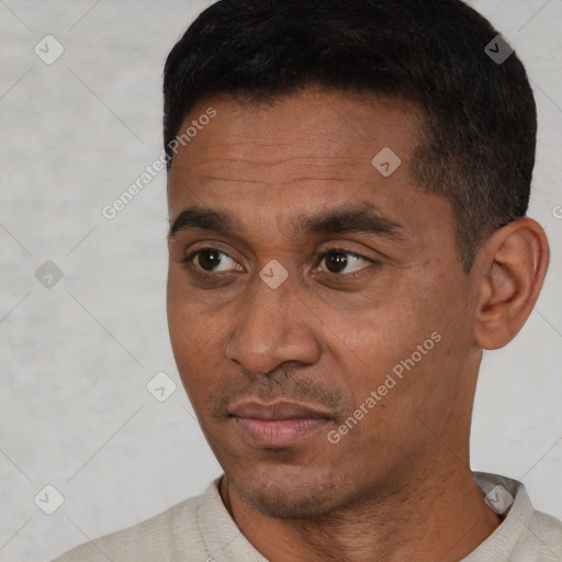 Neutral latino adult male with short  black hair and brown eyes