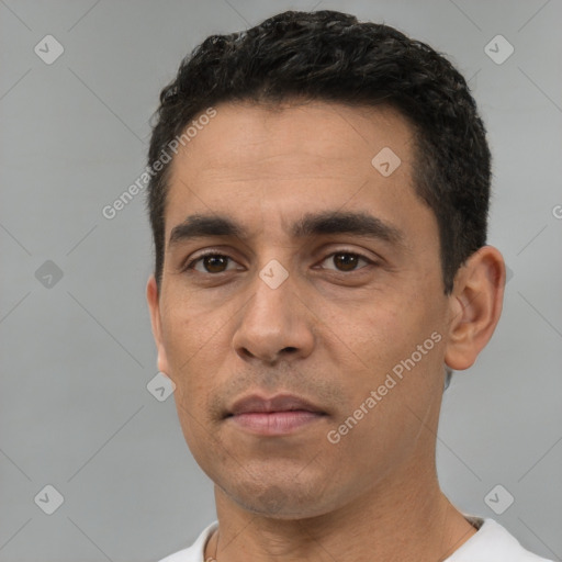 Neutral white adult male with short  black hair and brown eyes