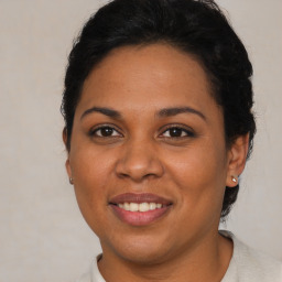 Joyful latino young-adult female with short  brown hair and brown eyes