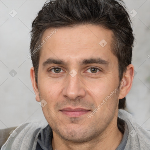 Joyful white adult male with short  brown hair and brown eyes