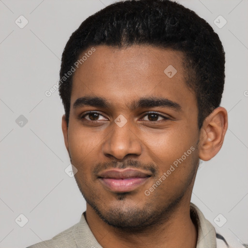 Joyful black young-adult male with short  black hair and brown eyes