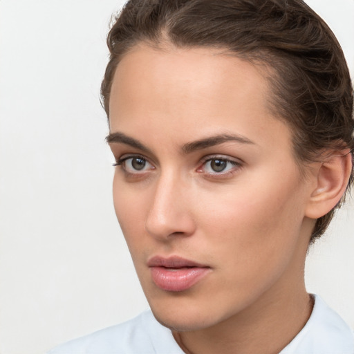 Neutral white young-adult female with short  brown hair and brown eyes