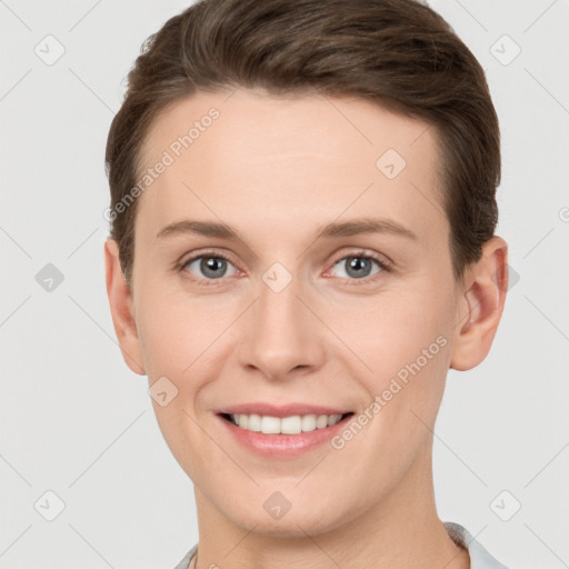 Joyful white young-adult female with short  brown hair and grey eyes