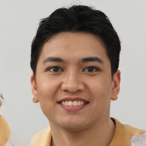 Joyful white young-adult male with short  brown hair and brown eyes