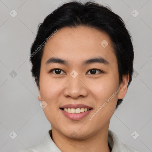 Joyful asian young-adult male with short  black hair and brown eyes