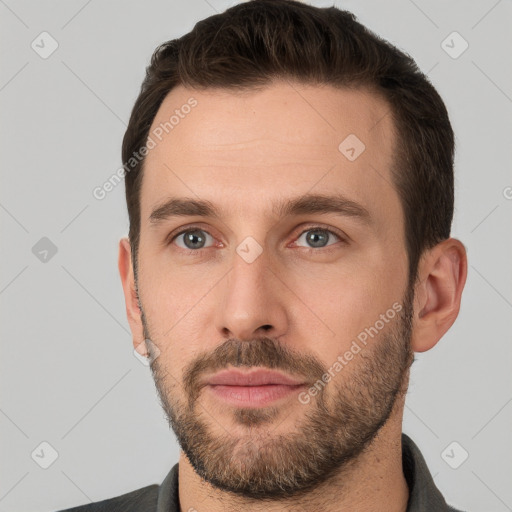 Neutral white young-adult male with short  brown hair and grey eyes