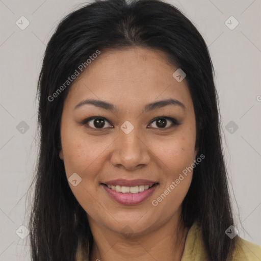 Joyful latino young-adult female with long  brown hair and brown eyes