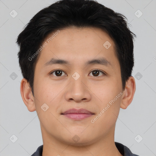 Joyful asian young-adult male with short  brown hair and brown eyes