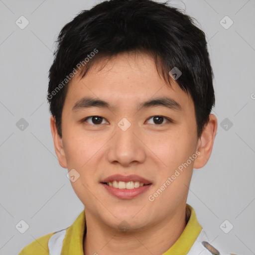 Joyful asian young-adult male with short  brown hair and brown eyes