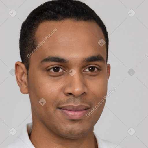 Joyful black young-adult male with short  brown hair and brown eyes