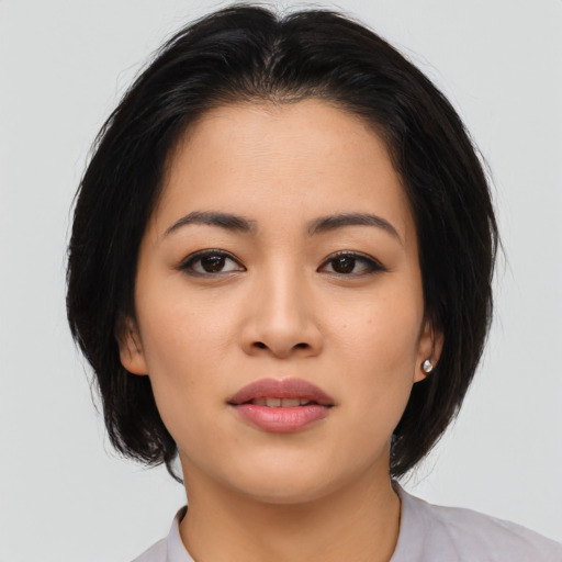 Neutral asian young-adult female with medium  brown hair and brown eyes
