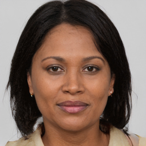 Joyful asian adult female with medium  brown hair and brown eyes
