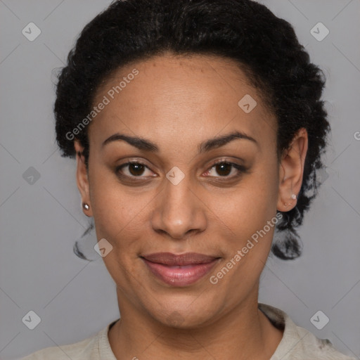 Joyful black adult female with short  black hair and brown eyes